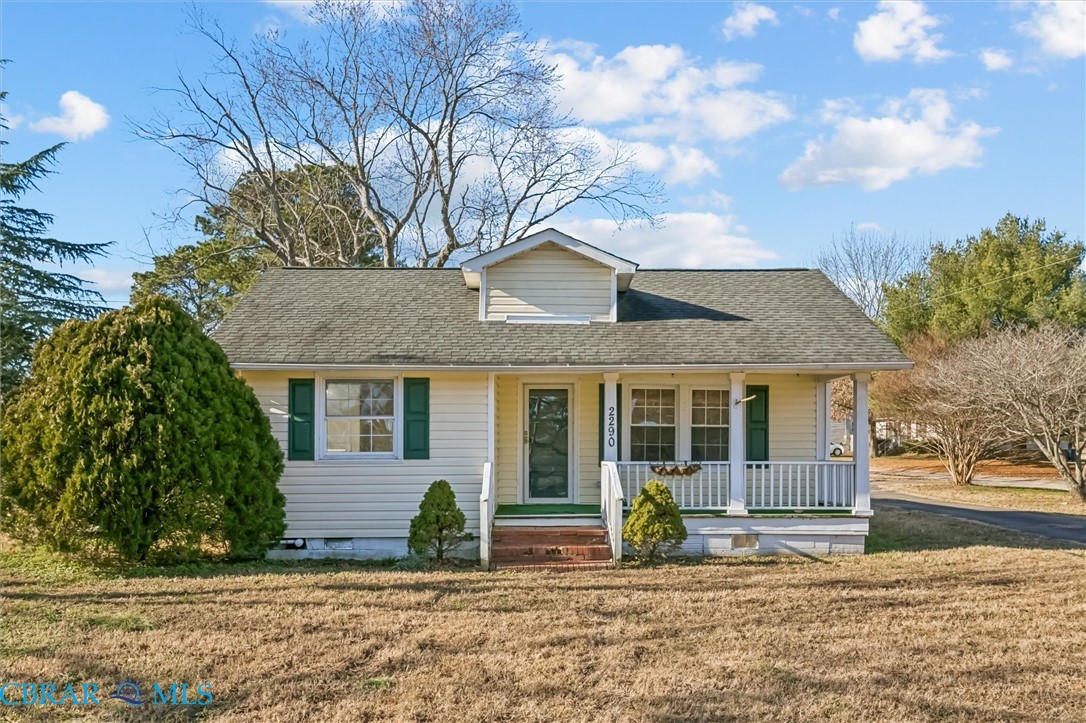 2290 Hayes Road Hayes, VA 23072 - Photo 1 of 32 View of front of house featuring covered porch, roof with shingles, and a front lawn