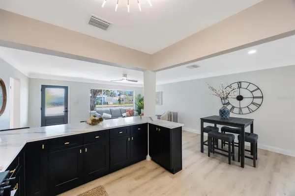a kitchen with a sink and cabinets