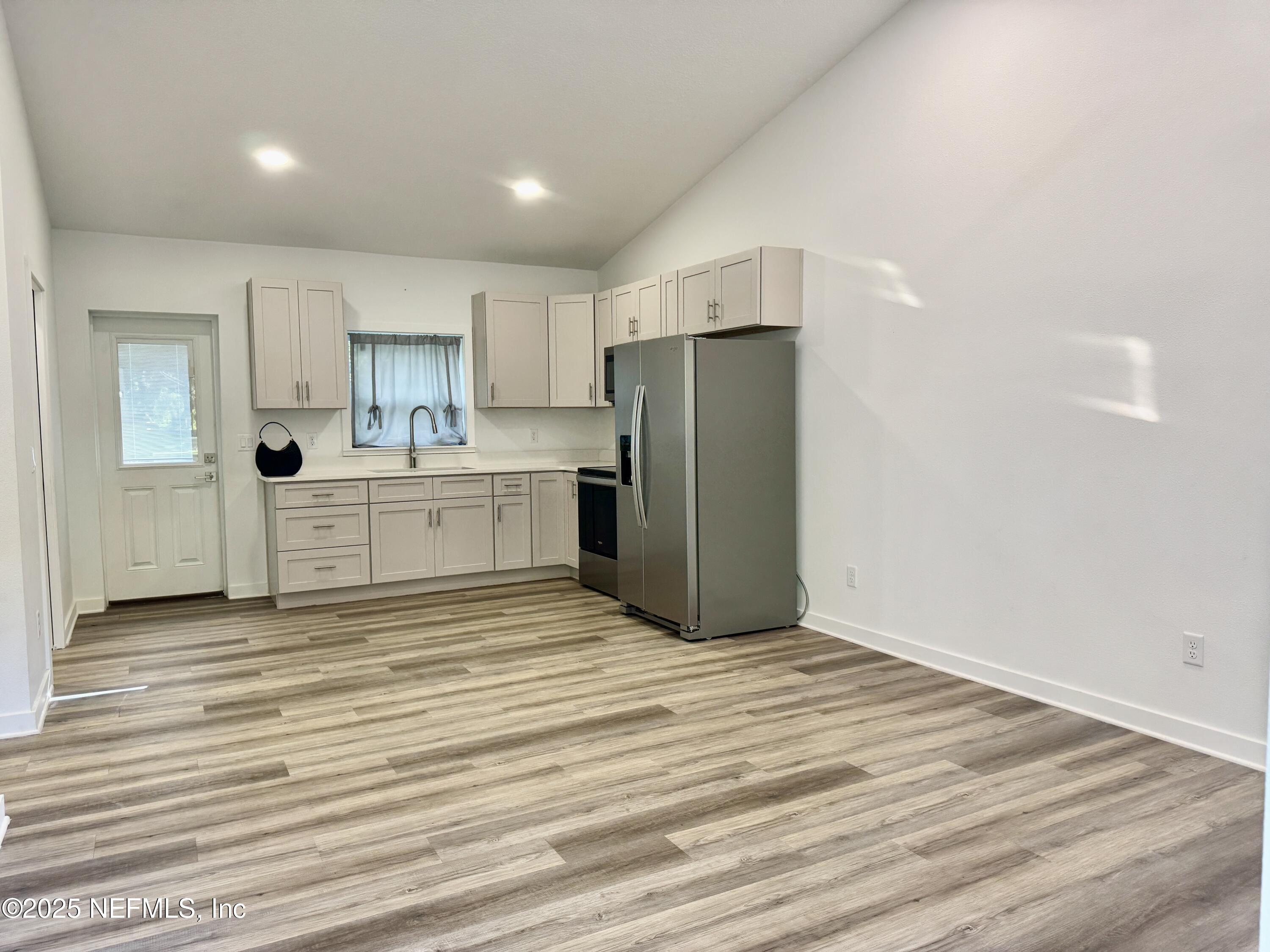 302 Azealea Avenue Interlachen, FL 32148 - Photo 16 of 38 a view of a kitchen with a sink and cabinets