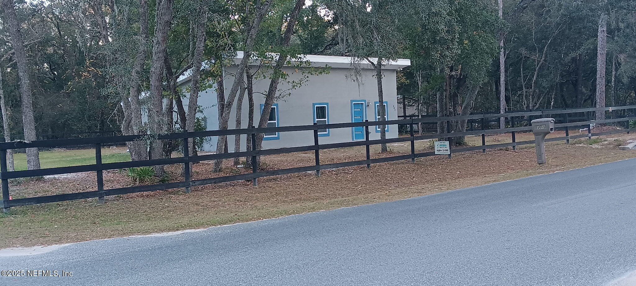 302 Azealea Avenue Interlachen, FL 32148 - Photo 2 of 38 a view of backyard with deck and trees