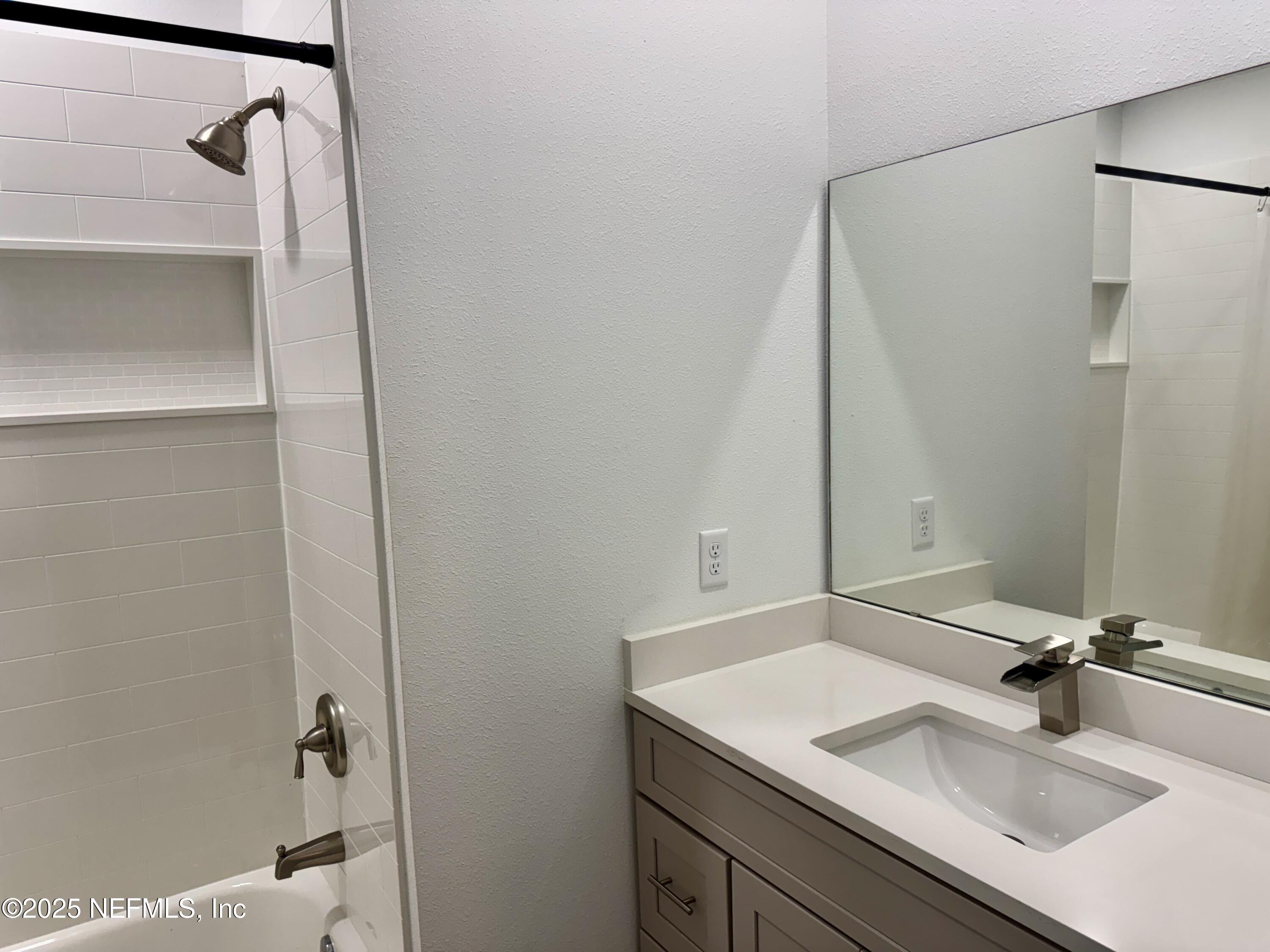 302 Azealea Avenue Interlachen, FL 32148 - Photo 27 of 38 a bathroom with a sink and a mirror