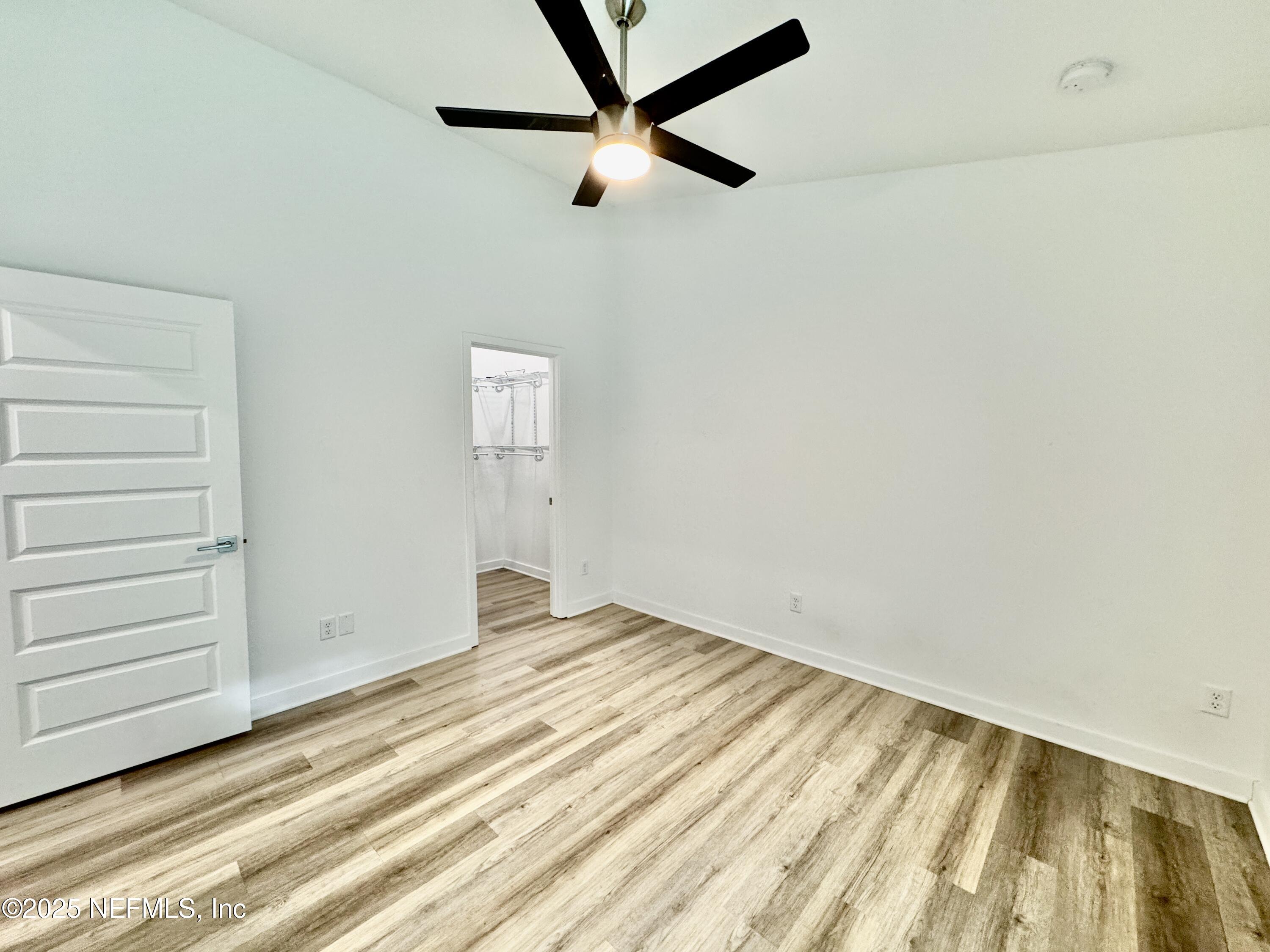 302 Azealea Avenue Interlachen, FL 32148 - Photo 29 of 38 a view of room with wooden floor