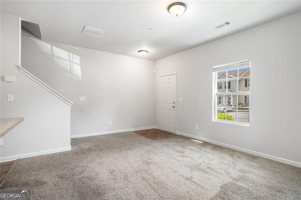 4043 Avalon Road Southwest Atlanta, GA 30331 - Photo 2 of 10 a view of an empty room with a window