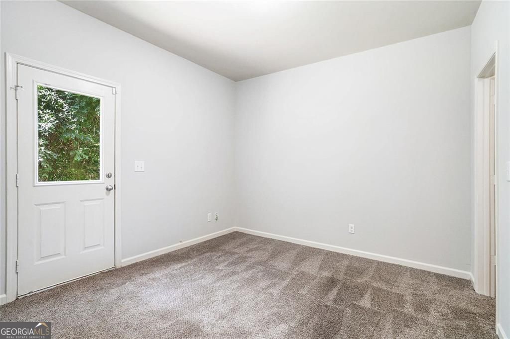 4043 Avalon Road Southwest Atlanta, GA 30331 - Photo 3 of 10 an empty room with a window
