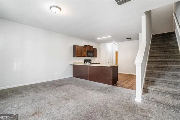 a view of kitchen with sink