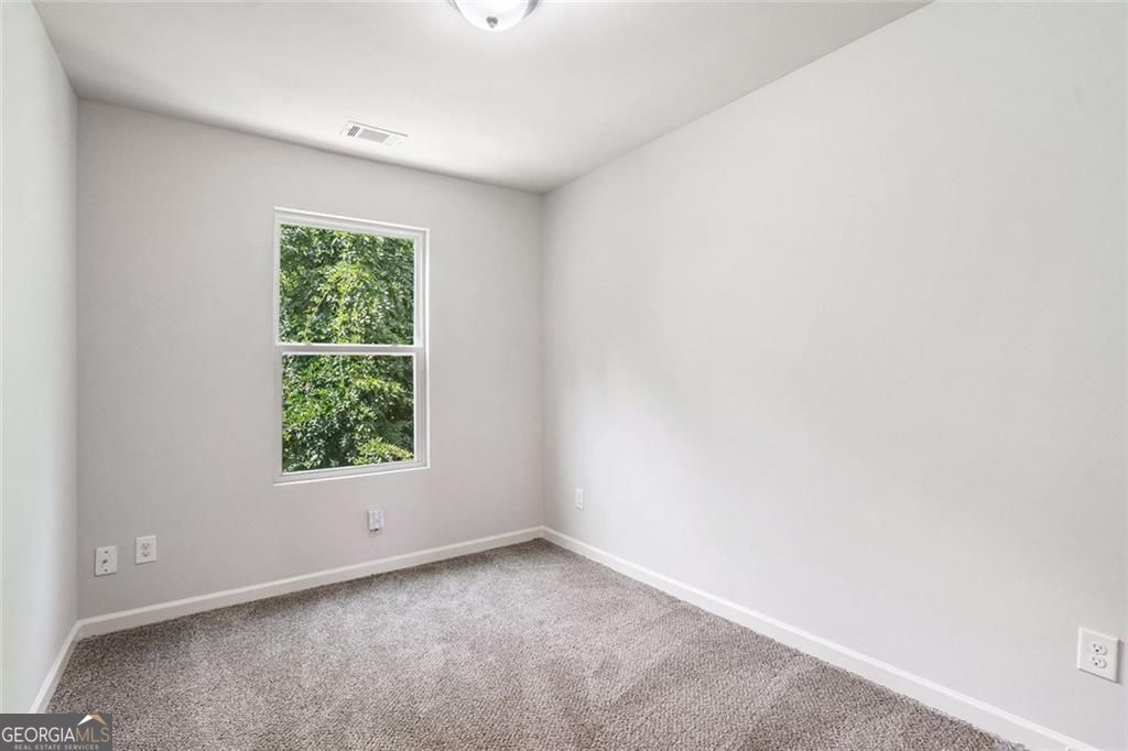 4043 Avalon Road Southwest Atlanta, GA 30331 - Photo 7 of 10 an empty room with a window