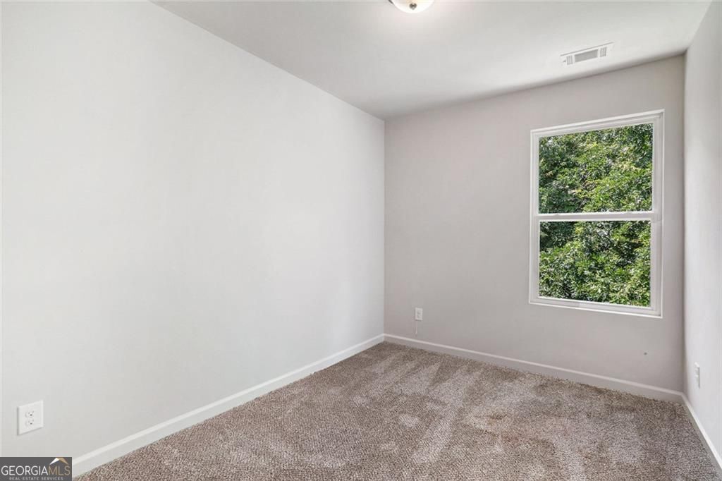 4043 Avalon Road Southwest Atlanta, GA 30331 - Photo 8 of 10 an empty room with a window
