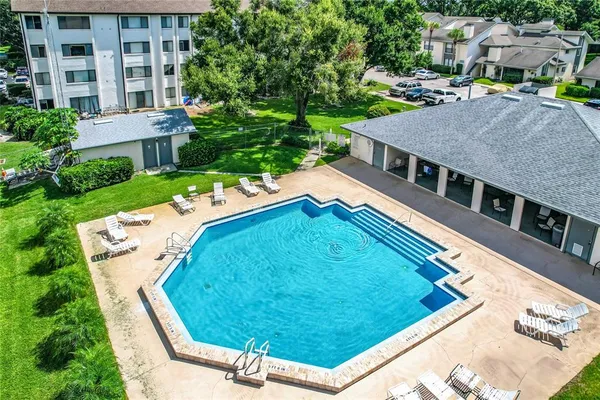 a view of a swimming pool with a patio