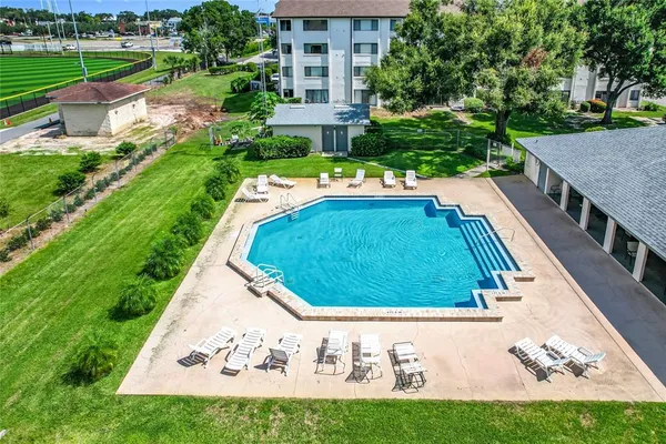 a view of a swimming pool with a yard