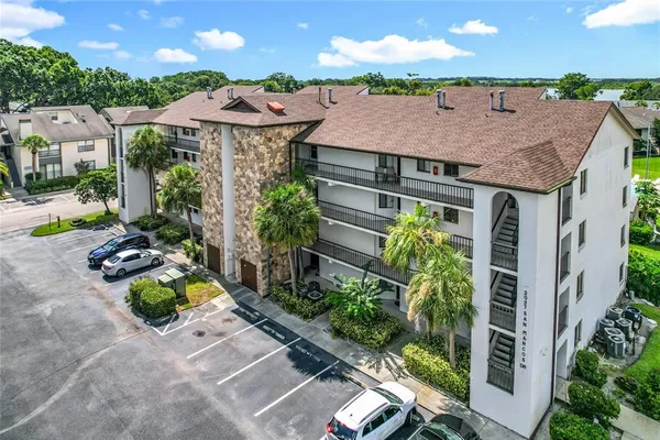 a aerial view of a house with yard and sitting area