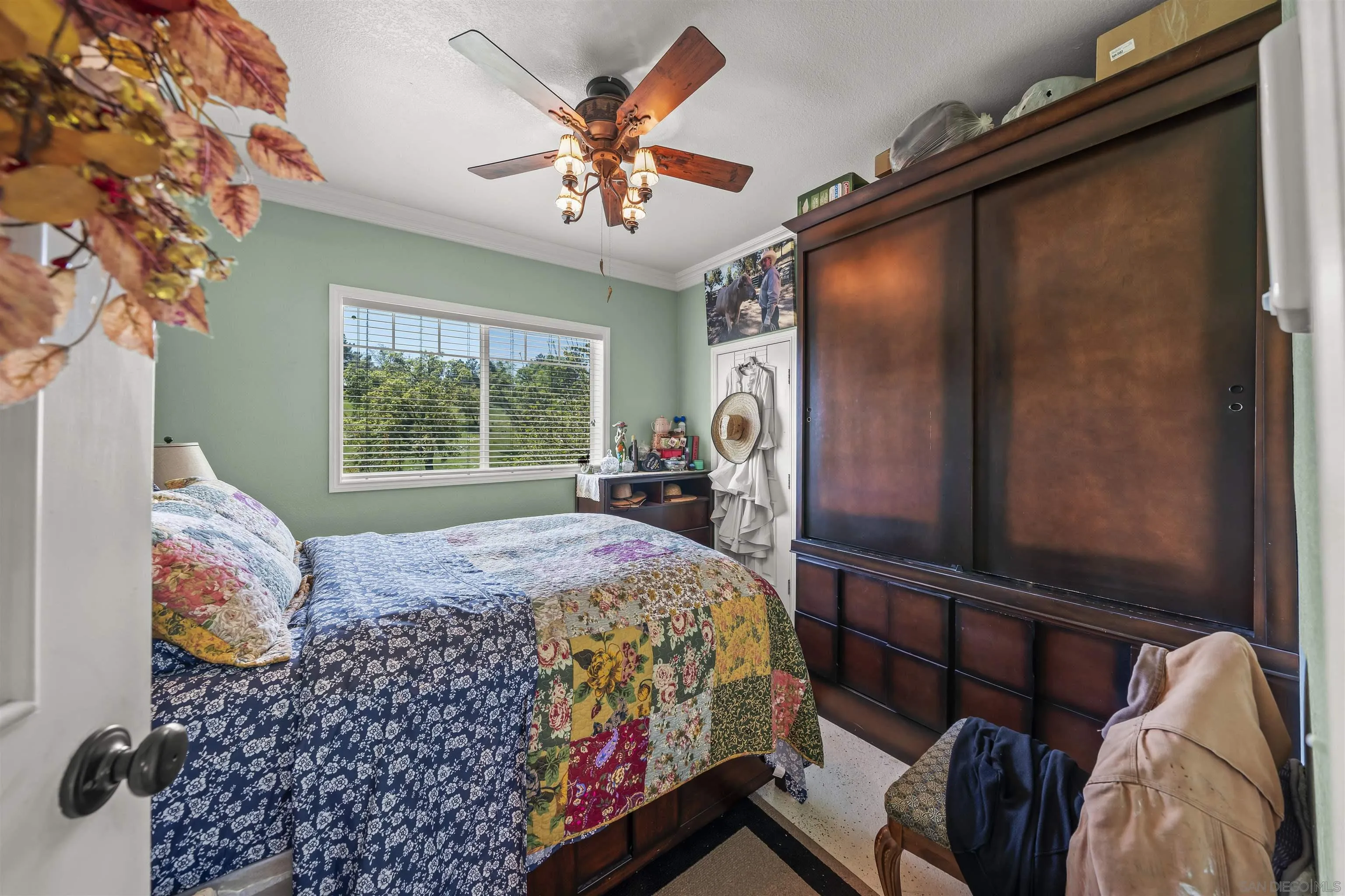 2464 Wynola Road Julian, CA 92036 - Photo 15 of 50 a bedroom with a bed and a window