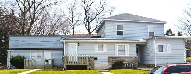 a front view of a house with swimming pool