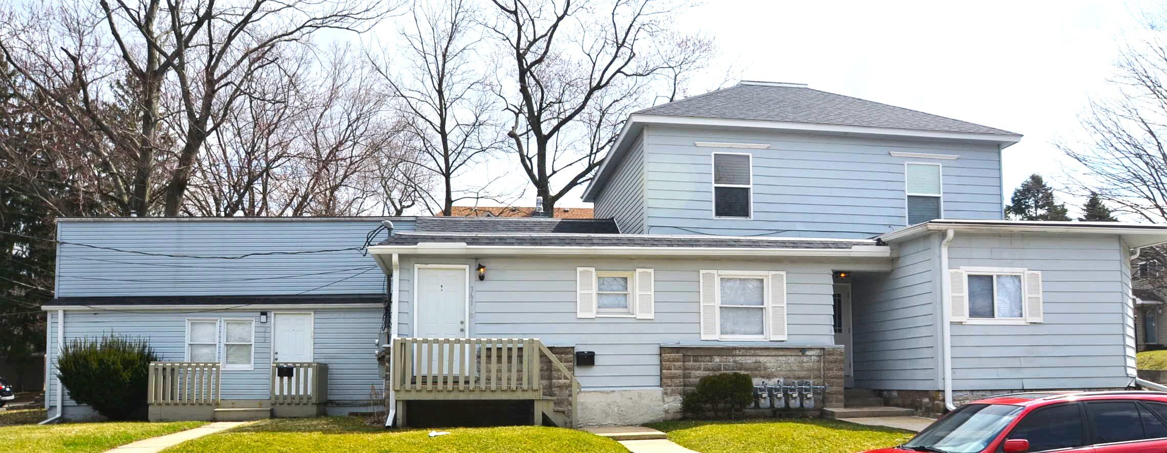 a front view of a house with swimming pool