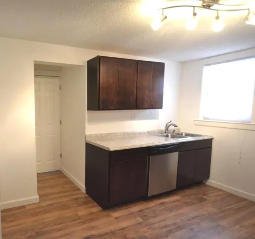 a view wooden cabinets and sink