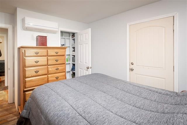 8092 Mt Carmel Road Decaturville, TN 38329 - Photo 11 of 24 a bedroom with a bed and a dresser