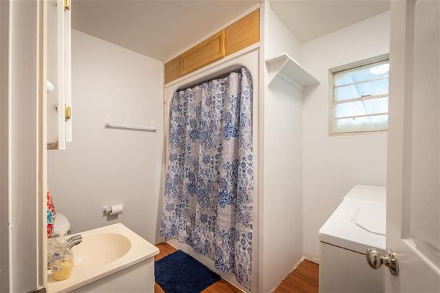 8092 Mt Carmel Road Decaturville, TN 38329 - Photo 12 of 24 a bathroom with a shower curtain and a sink
