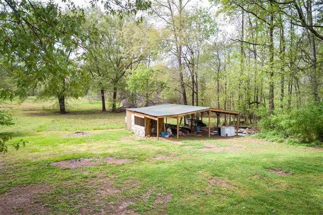 8092 Mt Carmel Road Decaturville, TN 38329 - Photo 17 of 24 a view of a house with a yard and sitting area
