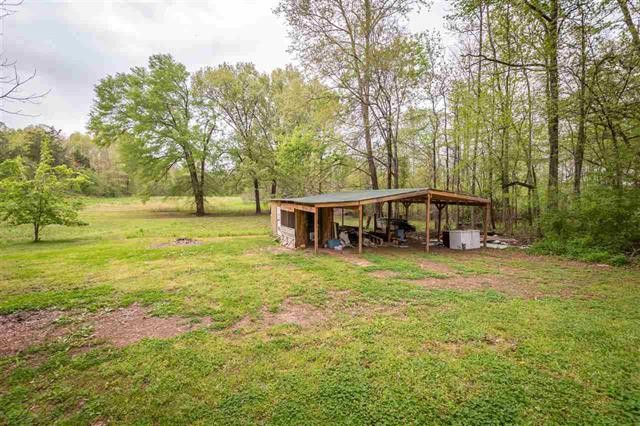 8092 Mt Carmel Road Decaturville, TN 38329 - Photo 21 of 24 a view of a house with garden and sitting area