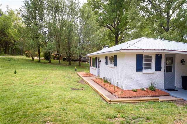8092 Mt Carmel Road Decaturville, TN 38329 - Photo 23 of 24 a view of a house with backyard and tree