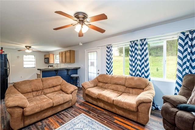 8092 Mt Carmel Road Decaturville, TN 38329 - Photo 6 of 24 a living room with furniture and a large window