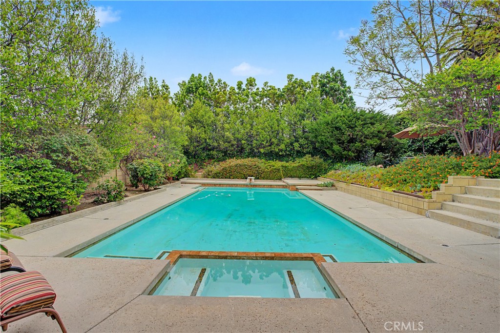 22671 Town Crier Road Calabasas, CA 91302 - Photo 13 of 35 a view of a back yard of the house