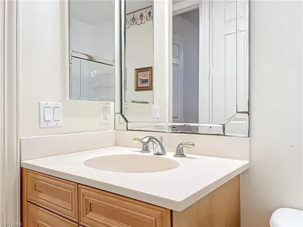 a bathroom with a sink and a mirror