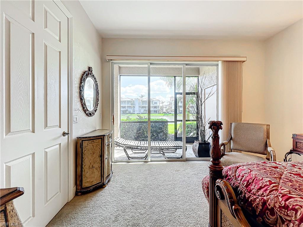 722 Regency Reserve Circle, Unit 3001 Naples, FL 34119 - Photo 28 of 50 a bedroom with a bed and a large window