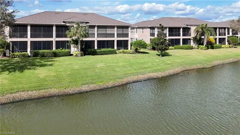 a front view of a house with a yard table and chairs