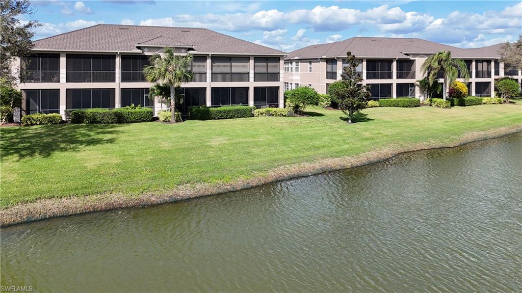 722 Regency Reserve Circle, Unit 3001 Naples, FL 34119 - Photo 39 of 50 a front view of a house with a yard table and chairs
