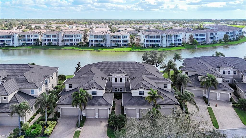 722 Regency Reserve Circle, Unit 3001 Naples, FL 34119 - Photo 45 of 50 an aerial view of a house with a garden