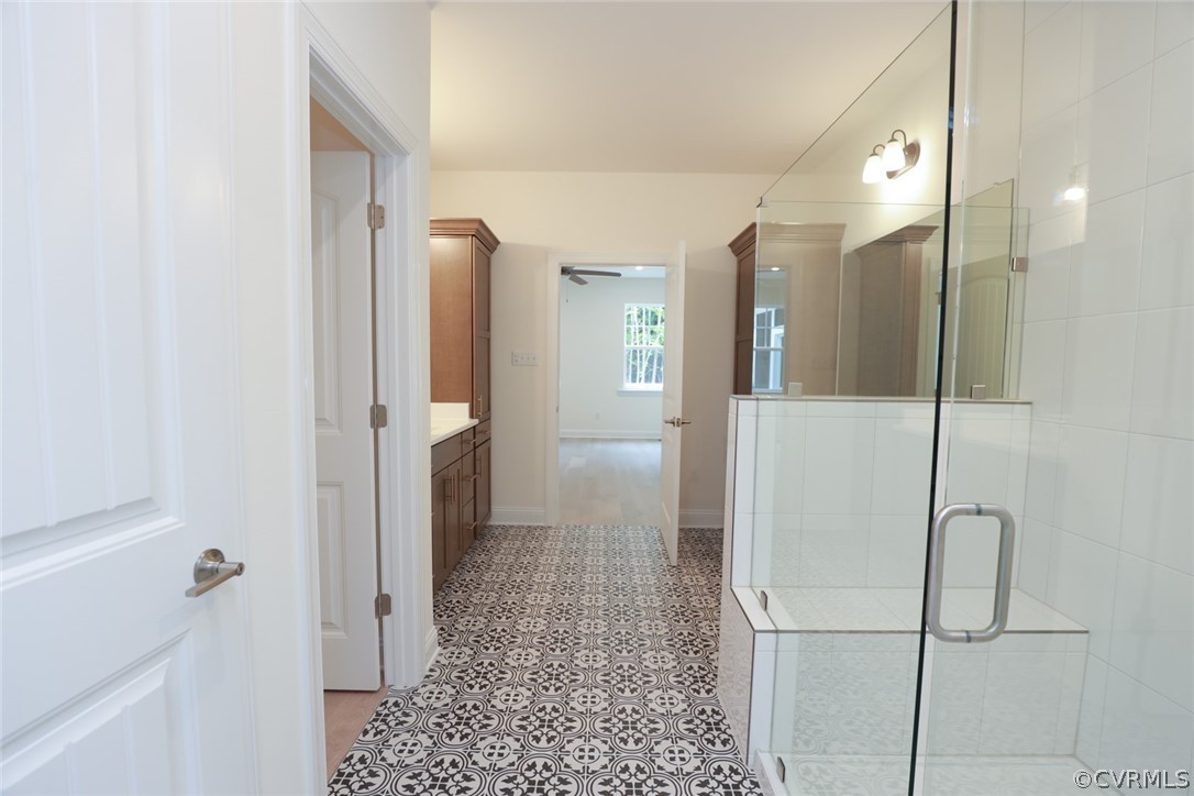 3404 Nickel Spring Sandy Hook, VA 23153 - Photo 20 of 45 a bathroom with a glass shower door and a sink