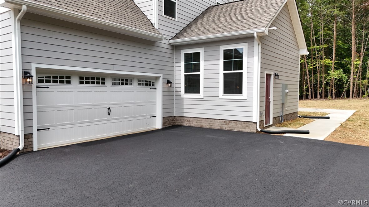3404 Nickel Spring Sandy Hook, VA 23153 - Photo 38 of 45 a view of a house with garage