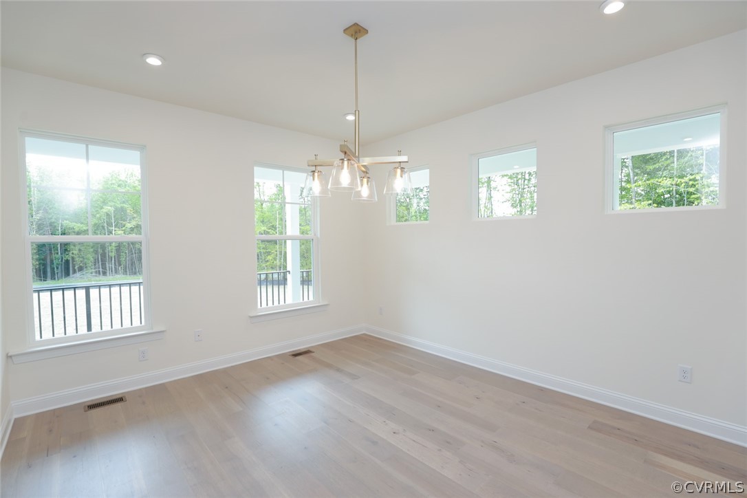 3404 Nickel Spring Sandy Hook, VA 23153 - Photo 6 of 45 a view of an empty room with wooden floor and windows