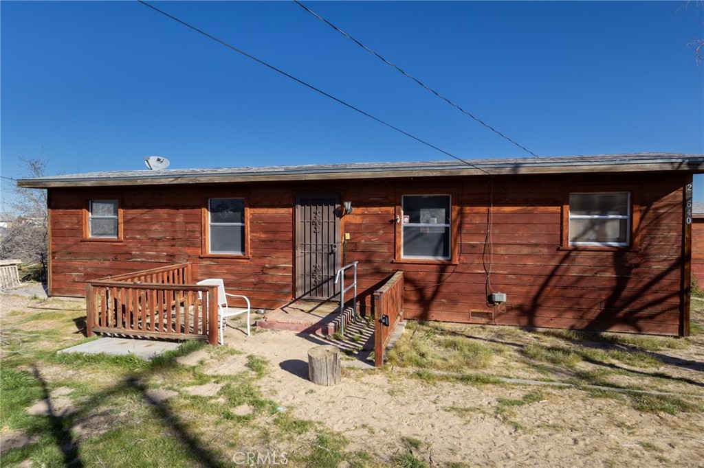 a backyard of a house with barbeque oven