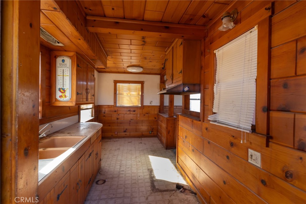 25640 Jasper Road Barstow, CA 92311 - Photo 11 of 48 a bathroom with a granite countertop double vanity sink a mirror and a bathtub