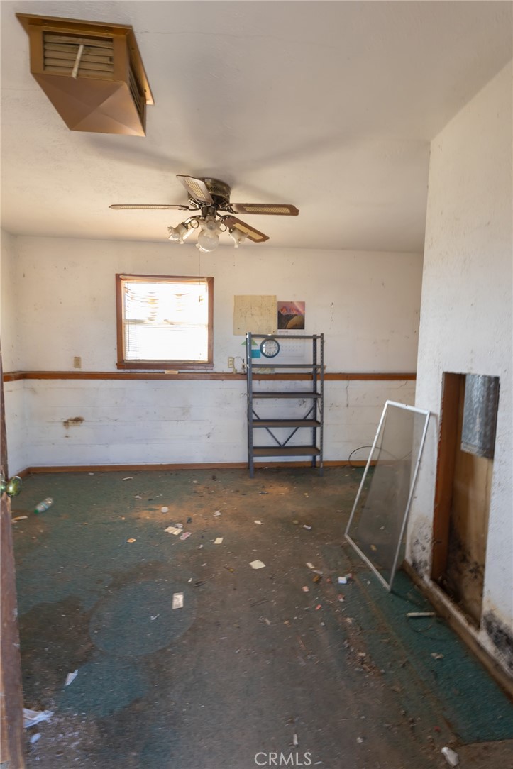 25640 Jasper Road Barstow, CA 92311 - Photo 23 of 48 a view of room with window and furniture
