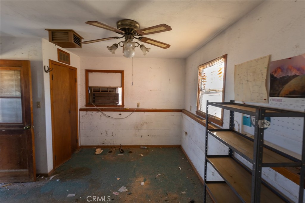 25640 Jasper Road Barstow, CA 92311 - Photo 26 of 48 a view of room with window and hardwood floor