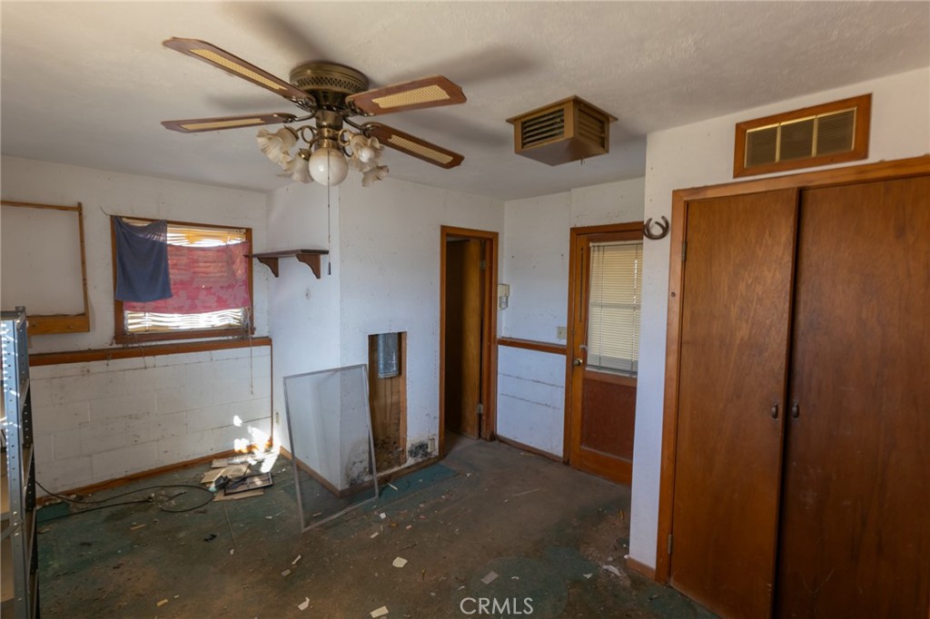 25640 Jasper Road Barstow, CA 92311 - Photo 27 of 48 a view of a livingroom with a ceiling fan and window