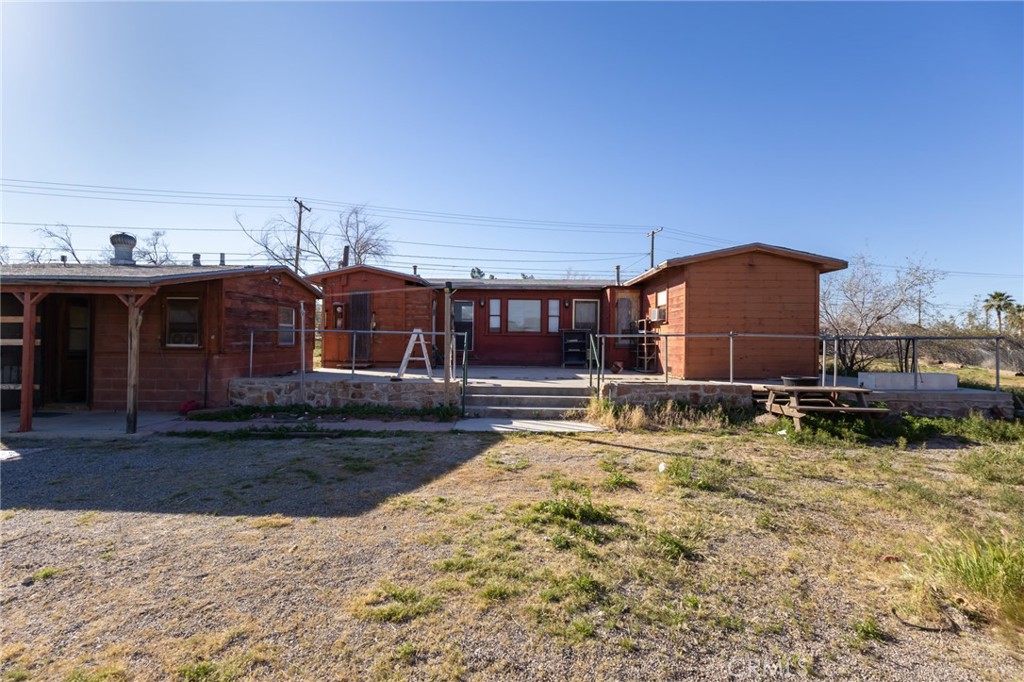25640 Jasper Road Barstow, CA 92311 - Photo 35 of 48 a view of a house with a yard