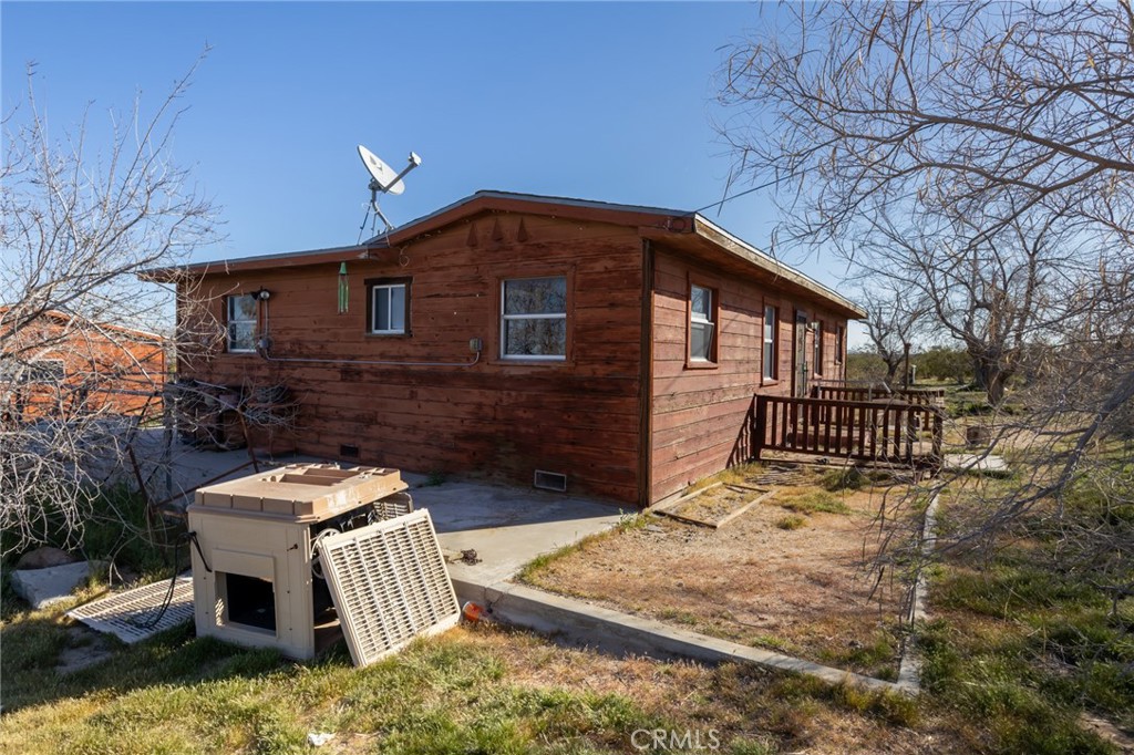 25640 Jasper Road Barstow, CA 92311 - Photo 4 of 48 a front view of a house with garden and patio