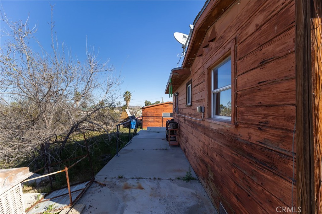 25640 Jasper Road Barstow, CA 92311 - Photo 5 of 48 a view of a pathway of a house with backyard