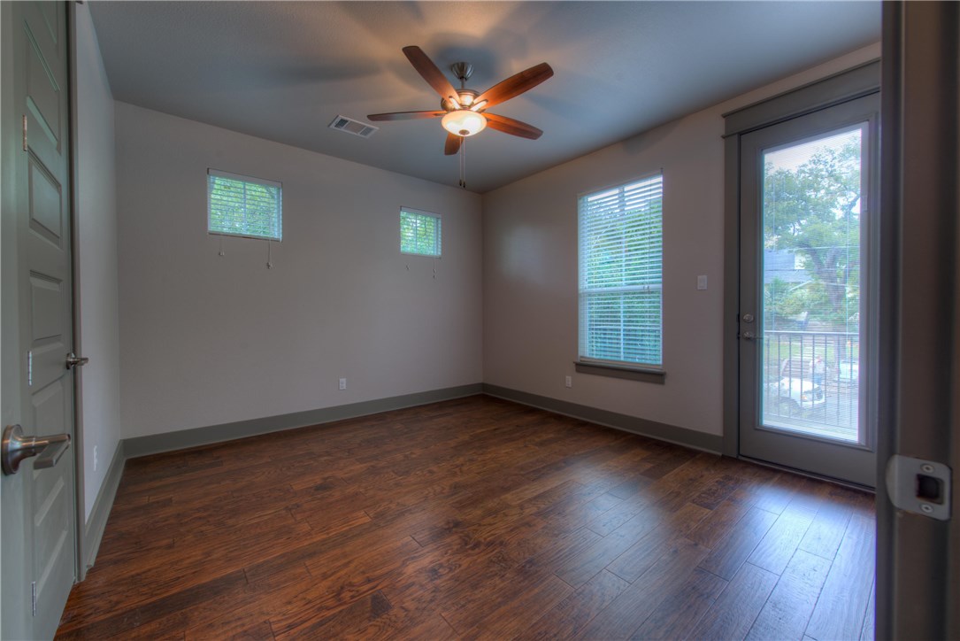 3110 Grandview Street Austin, TX 78705 - Photo 17 of 30 an empty room with wooden floor and windows