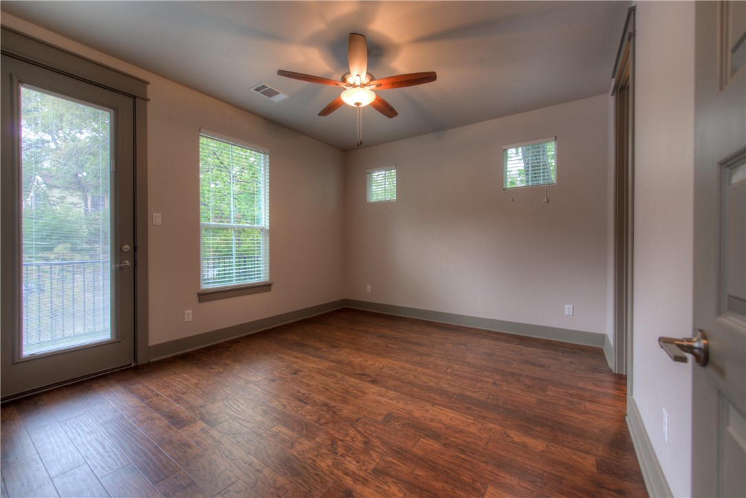 3110 Grandview Street Austin, TX 78705 - Photo 20 of 30 a view of an empty room with wooden floor and a window