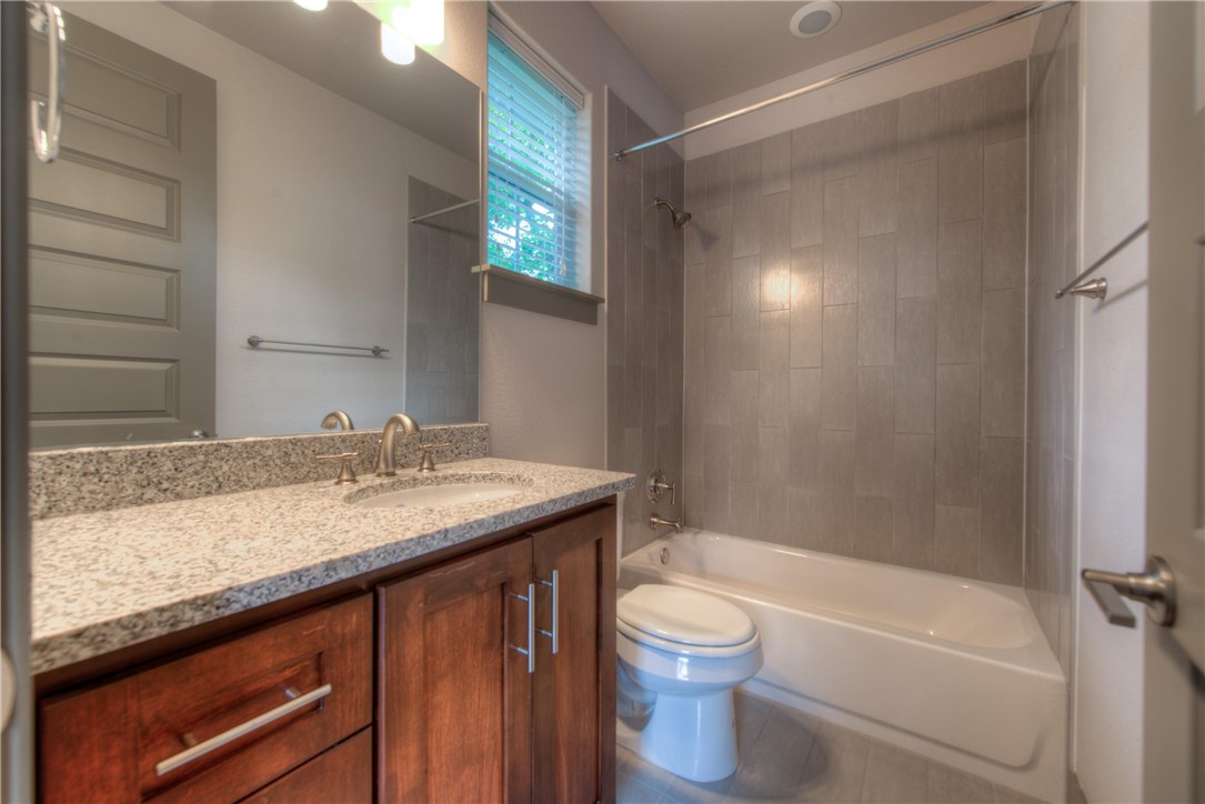 3110 Grandview Street Austin, TX 78705 - Photo 21 of 30 a bathroom with a granite countertop sink toilet and shower