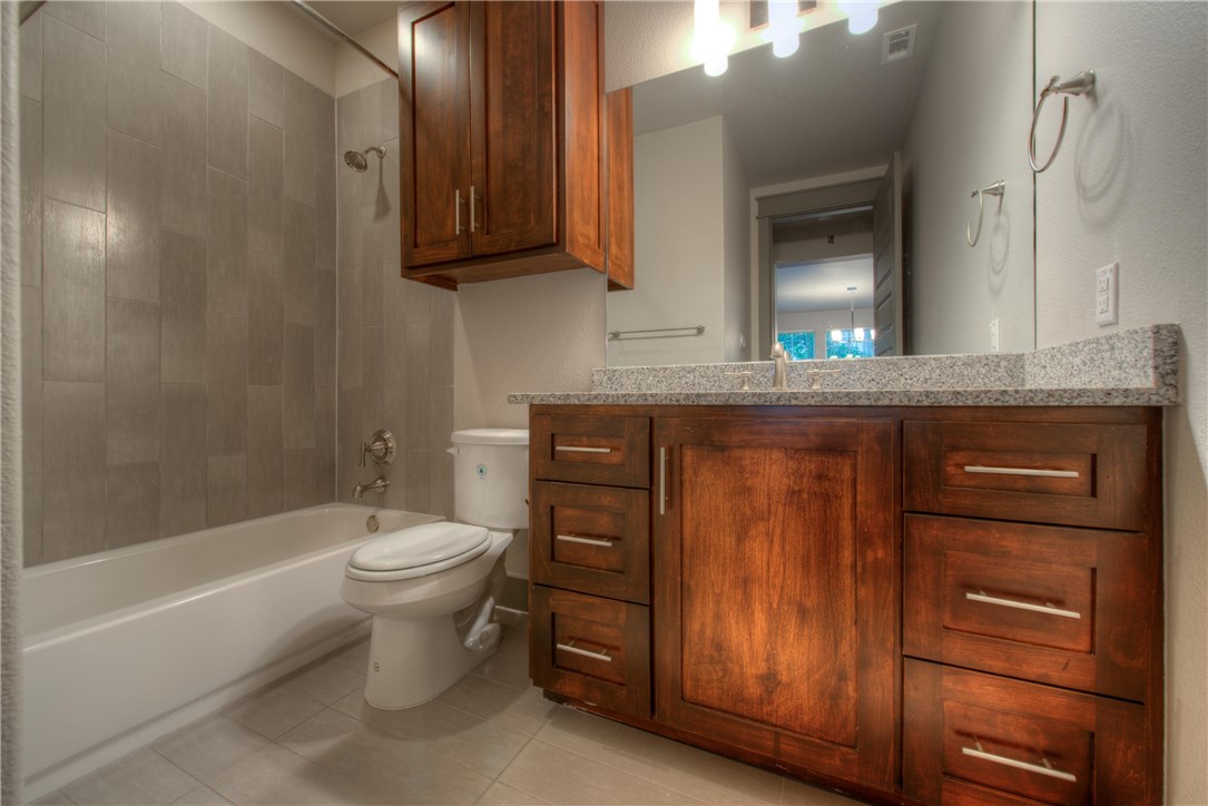3110 Grandview Street Austin, TX 78705 - Photo 28 of 30 a bathroom with a sink a toilet and bathtub