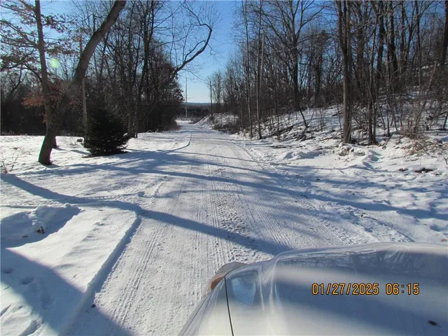 a view of snow on a road
