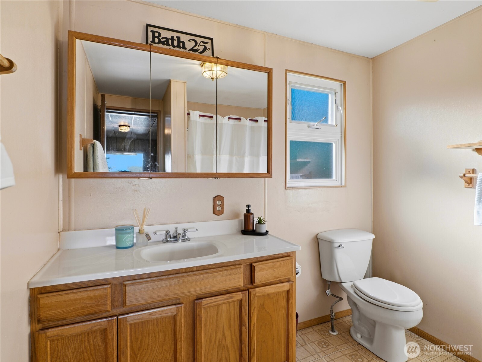 813 Fairmount Road Port Townsend, WA 98368 - Photo 13 of 30 a bathroom with a toilet sink and mirror