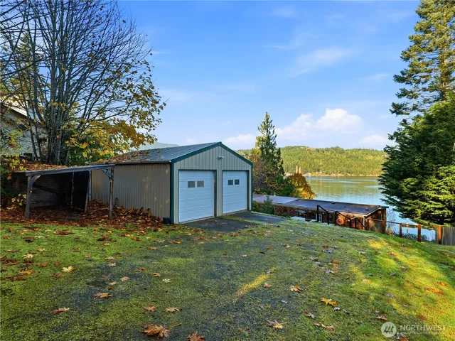 a view of a house with a yard and sitting area