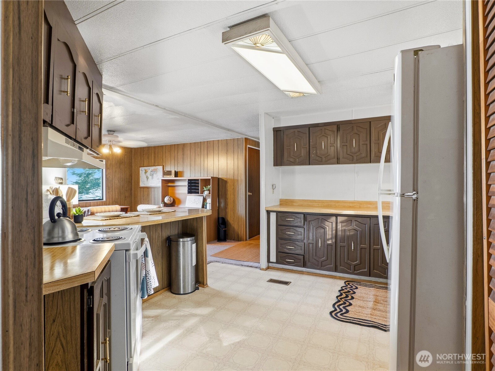 813 Fairmount Road Port Townsend, WA 98368 - Photo 8 of 30 a kitchen with a refrigerator and a sink