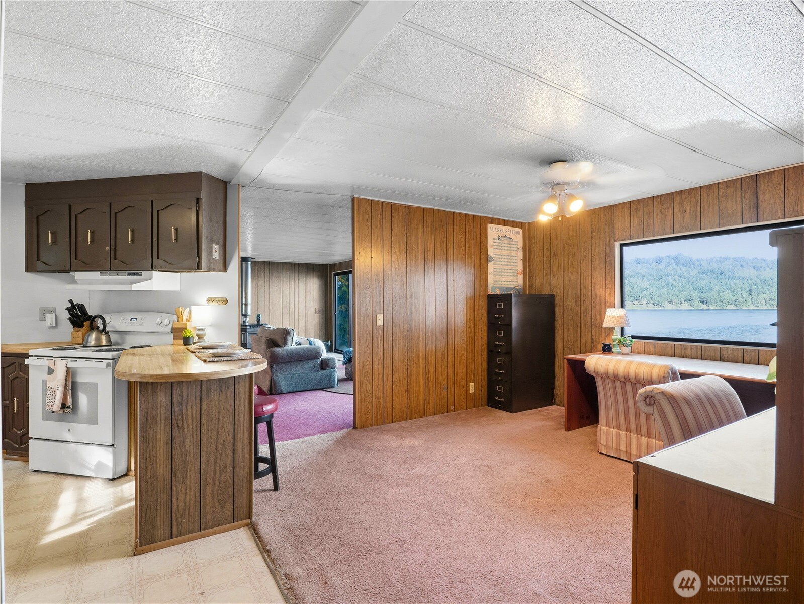 813 Fairmount Road Port Townsend, WA 98368 - Photo 9 of 30 a living room with furniture and a flat screen tv